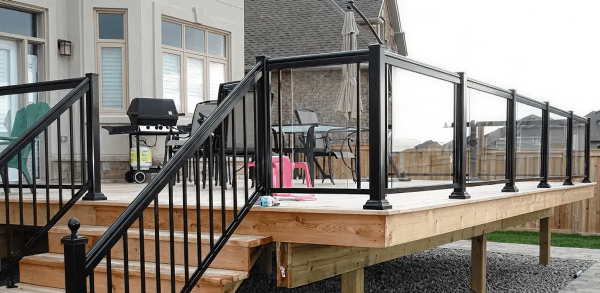 Handrail installation on a deck staircase for safety and code compliance in Wichita, KS