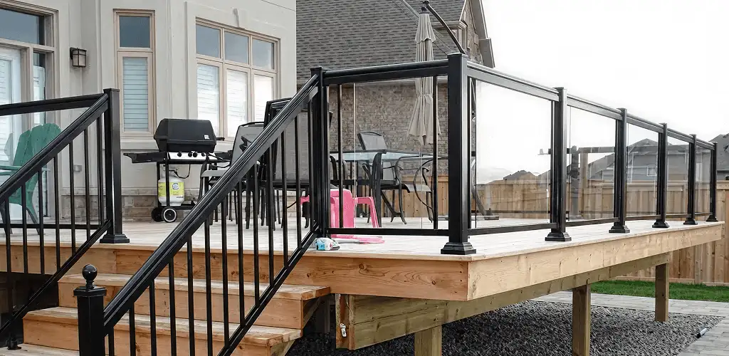 Handrail installation on a deck staircase for safety and code compliance in Wichita, KS