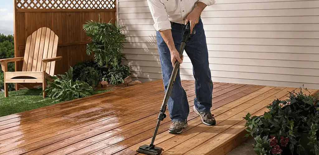 Deck staining service applying stain to a backyard wood deck in Wichita, KS